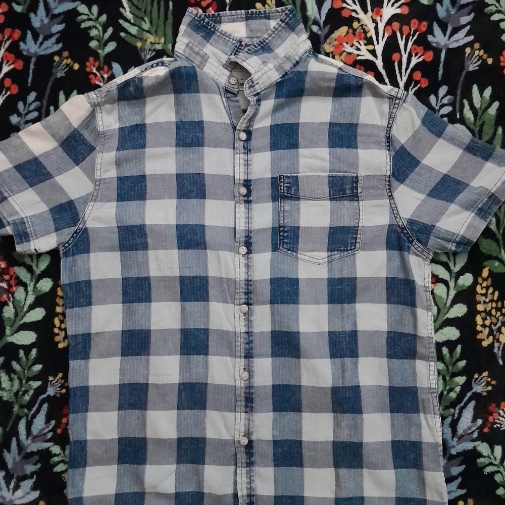 A blue Checkerboard button shirt